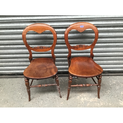 506 - Two Edwardian ladder back chairs.