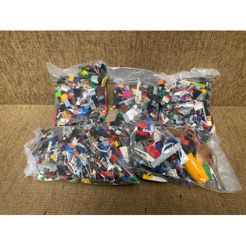 243 - Five bags of lego.