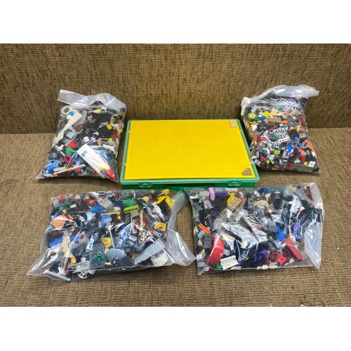 245 - 4 bags of LEGO and a box of LEGO.