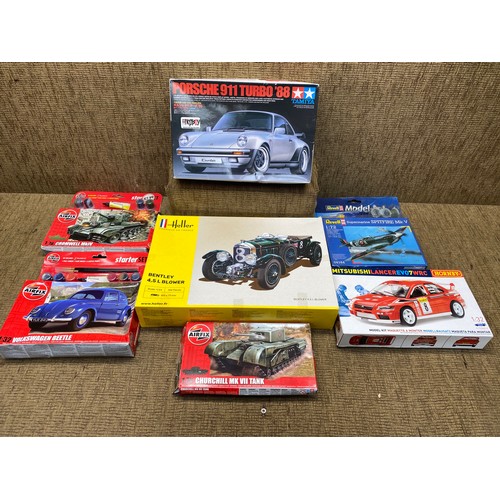 467 - selection of model kits including cars tanks and airplane