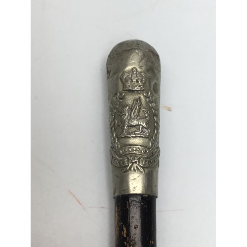 847 - South Wales borders, regimental band masters conductors baton. Silver topped with regimental crest.