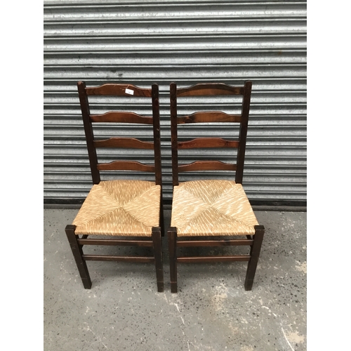 79 - Pair of antique low ladder back chairs with rush seat