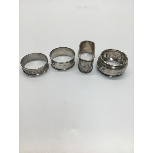 860 - Four sterling silver napkin rings.