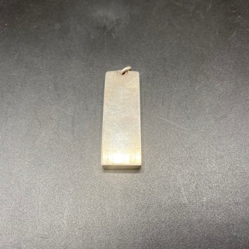 919 - Large silver ingot pendant.