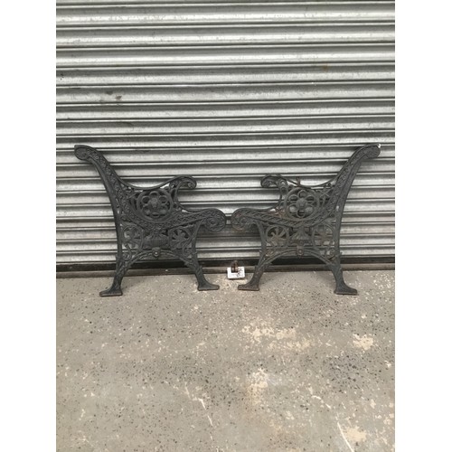 264 - Cast iron bench ends.