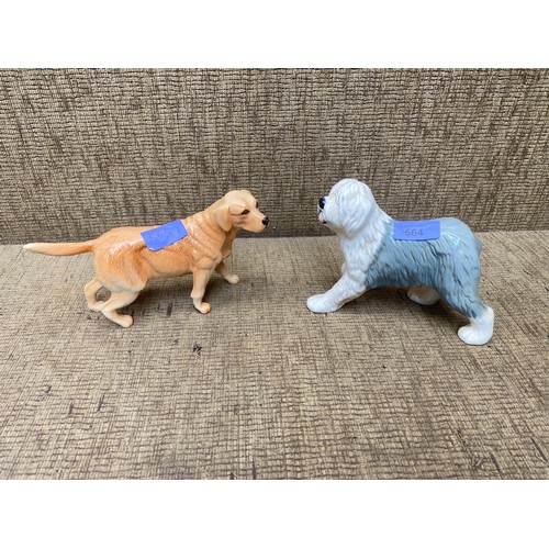 564 - Two Royal Doulton dogs, a Labrador retriever and a old English sheep dog. 14cm tall.