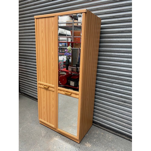 212 - Large bedroom wardrobe with mirrors; 56cm x 196cm x 90cm.