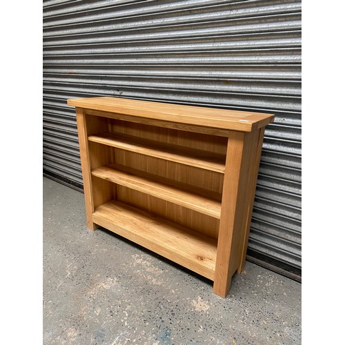 197 - Modern oak bookcase; 120cm x 96cm x 34cm.