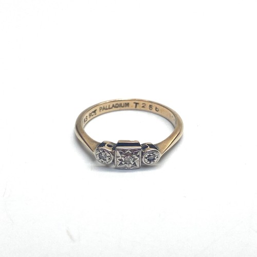 939 - 9ct gold three stone diamond .25k ring with palladium mount. Size M. 2g.