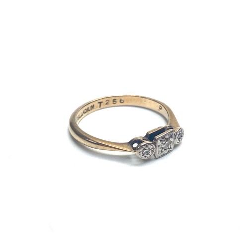 939 - 9ct gold three stone diamond .25k ring with palladium mount. Size M. 2g.