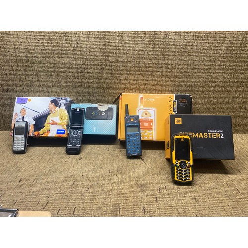 554 - Collection of vintage mobile phones and boxes including Motorola.