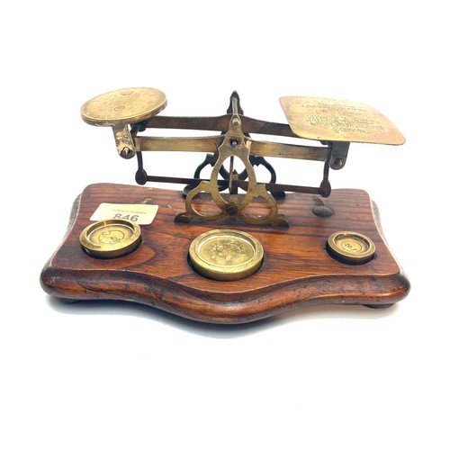 846 - Edwardian Brass and oak Postal Scales for letters, with original weights.