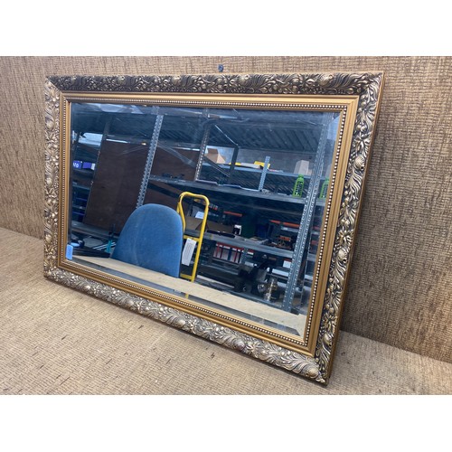 1056 - Art nouveau gold gilded frame bevel edge mirror.