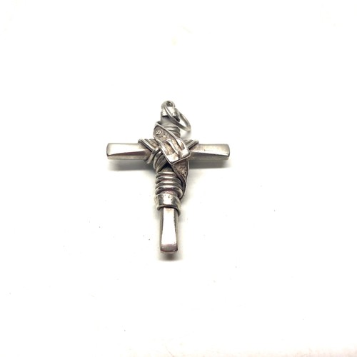 858 - Hand made heavy silver roped cross with belt buckle wrapped around.