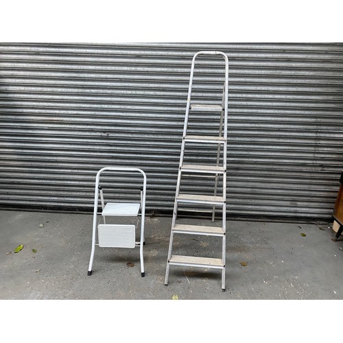 56 - two metal step ladders.