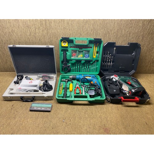 96 - Mixed tools including: A 13mm electric impact drill with accessories.