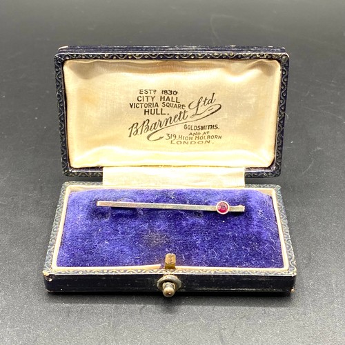 868 - 9ct gold and ruby bar brooch by B Barnet limited, 319 High Holdburn London, in its original box.  1.... 