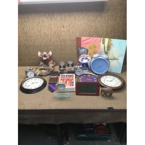 176 - mixed selection of clocks and pair of vintage roller skates.