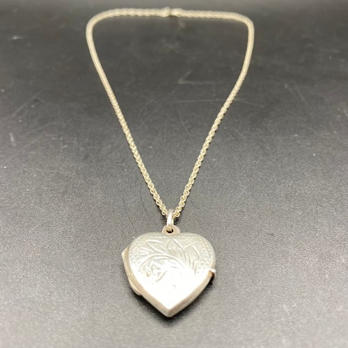 888 - Silver heart locket and chain.