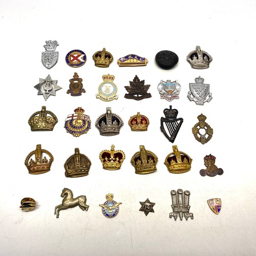 727 - 29 mixed military badges,