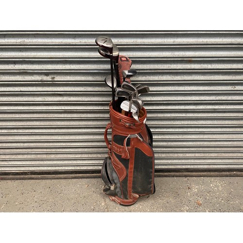 263 - Vintage golf club bag and a selection of Wilson, Dunlop and Donnay including: Driver, 9 Irons, wedge... 