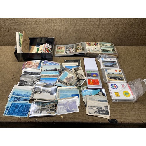 534 - Collection of post cards, cards and a cigarette album (empty).