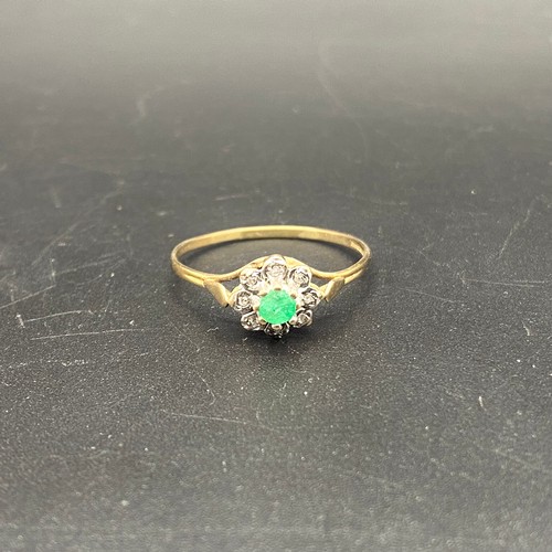 911 - 9KT Gold ring with emerald and diamonds. 1.6g .Size W.