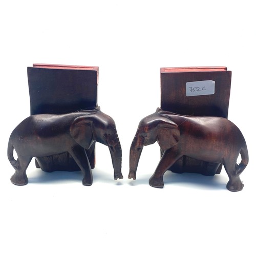 752C - Stunning pair of hand crafted wooden elephant bookends. 17cm.