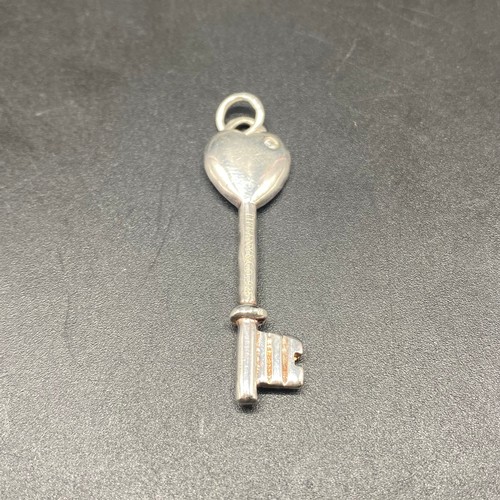 937 - Silver key pendant with Tiffany and Co engraving.