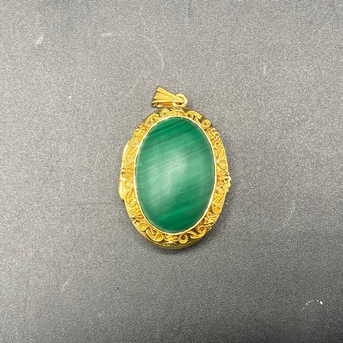 961 - Large gold locket with malachite stone. (Hallmarks to the top eyelet, possibly Egyptian, worn away. ... 