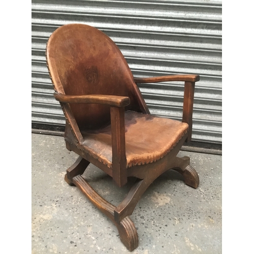 1178 - Baronial armchair with antique saddle leather and oak cross frame