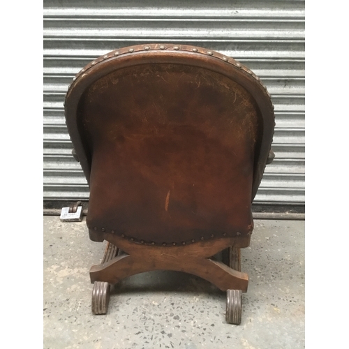 1178 - Baronial armchair with antique saddle leather and oak cross frame