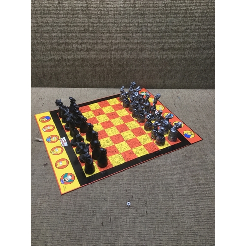 557 - Simpson 3d chess set including board but no box.