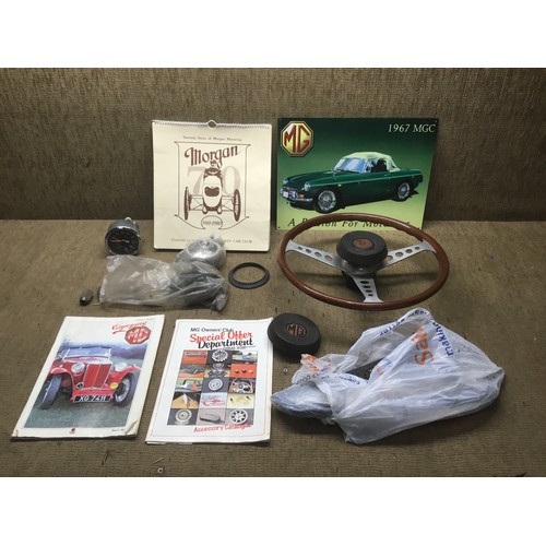 1184 - MG/Vintage car related items including a wooden steering wheel and window quarter glass.