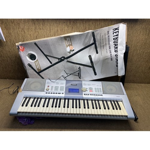 354 - Yamaha keyboard with stand and power lead.