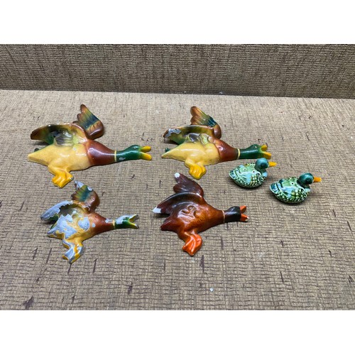 1069 - Interesting hand painted aluminum/cast ducks and wooden ducks.