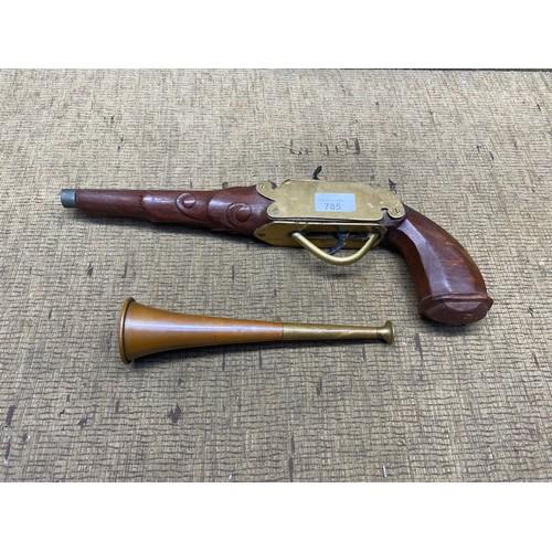 785 - Replica pistol and a hunting horn.