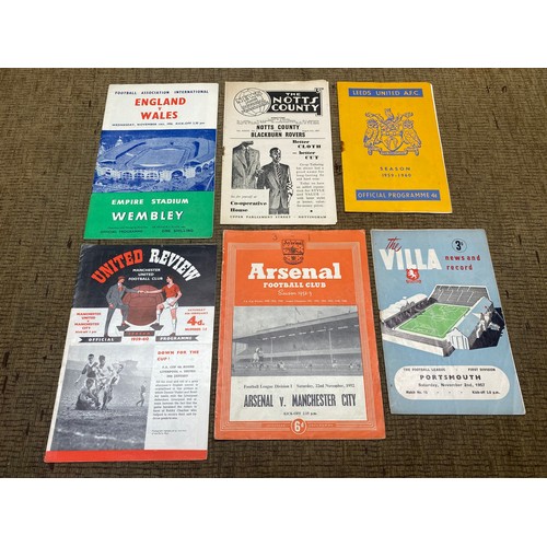 718 - Collection of early football programmes including Leeds and Arsenal.