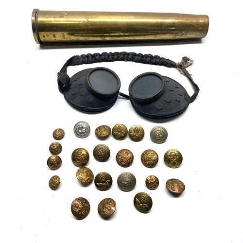 791 - Military buttons, a shell case and goggles.