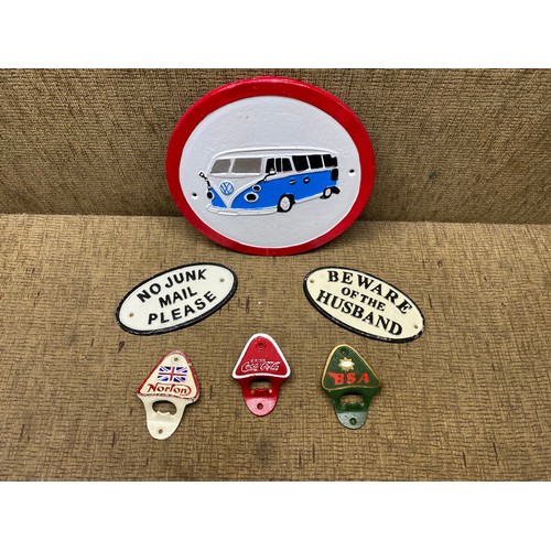 508 - Selection of cast iron items including: Coca-cola bottle openers and VW camper signs.