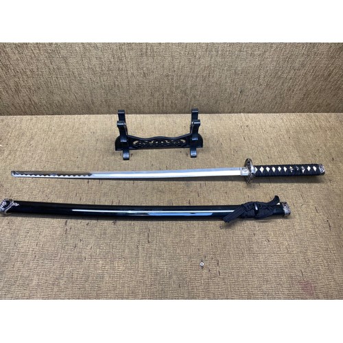 910 - Decorative samurai sword and stand (Local collection).