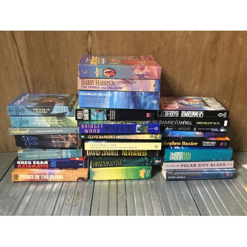 1169A - Books including Stephen Baxter and Charles DE lint.