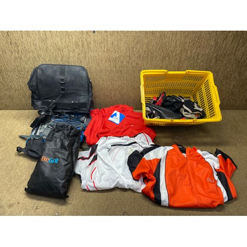 17 - mixed selection of biking equipment including ruck sacks and t-shirts.