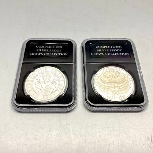 720 - Two The Royal mint £5 Crown .925 sterling silver proof encapsulated/slabbed coins (by danbury mint).... 