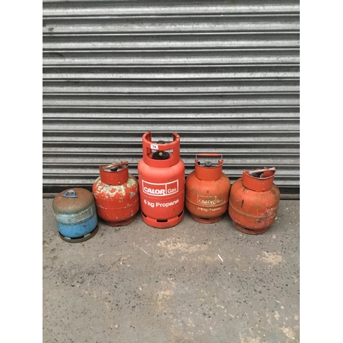 74 - 5 calor gas bottles.