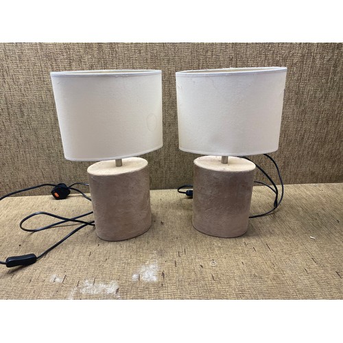 109 - Pair of suede bedroom lamps.