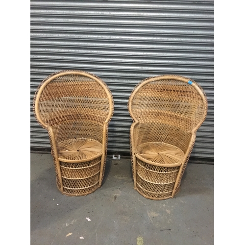 885 - A pair of vintage cane and wicker peacock chairs