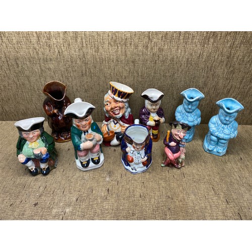 140 - Mixed collection of toby jugs.