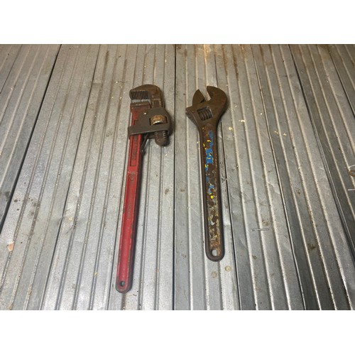 256 - monkey wrench 18inch and a adjustable spanner.