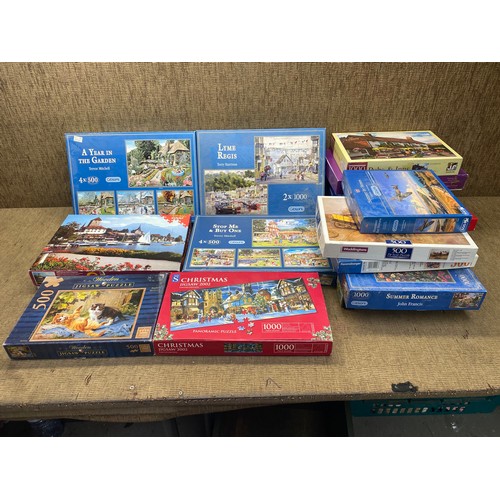 311A - large selection of jigsaw puzzles.